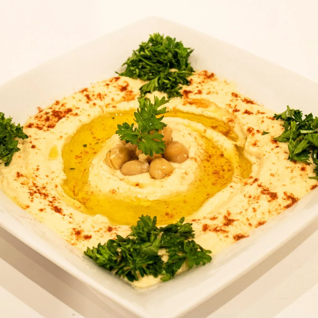 Hummus at Zaytoon Restaurant Winnipeg — creamy classic hummus topped with olive oil