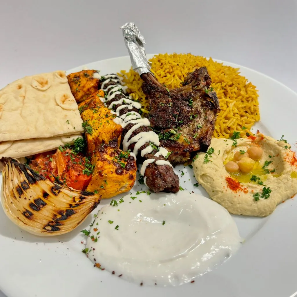 Mashawi mixed grill at Zaytoon Restaurant Winnipeg — flame-grilled kebabs and lamb chops in Osborne Village